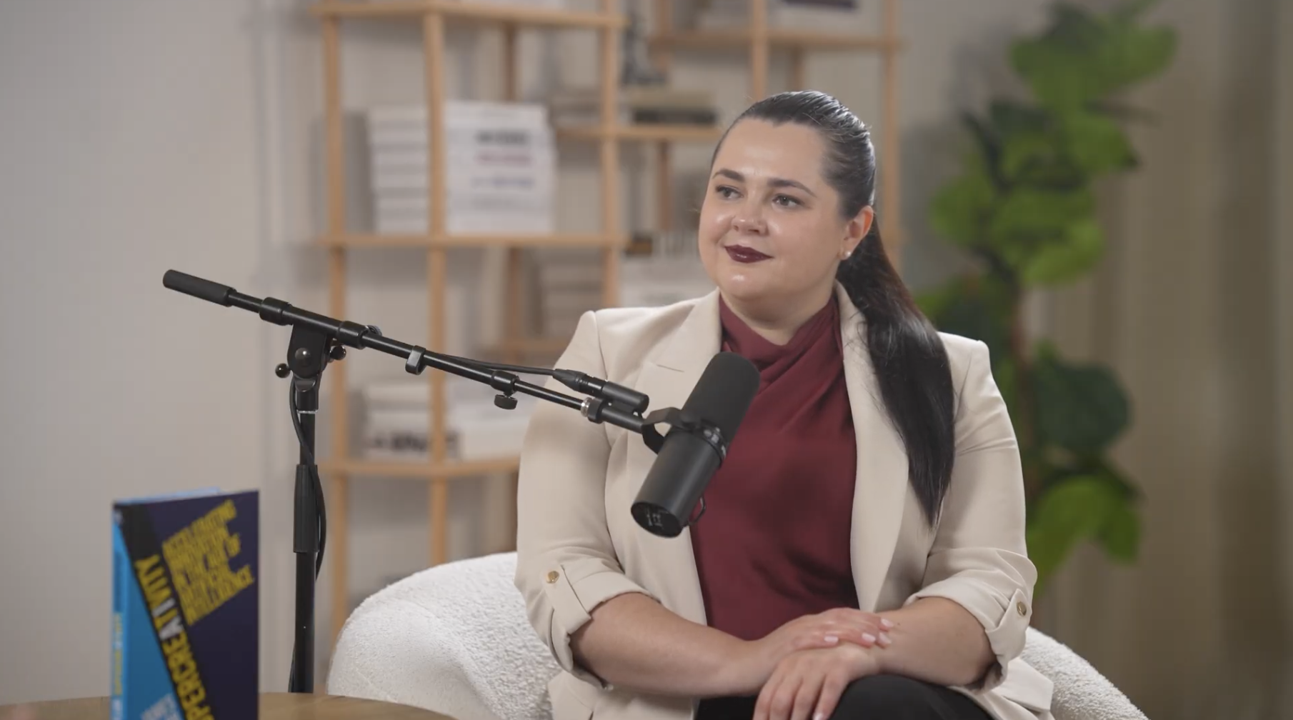 Galina Fendikevich in conversation at a microphone